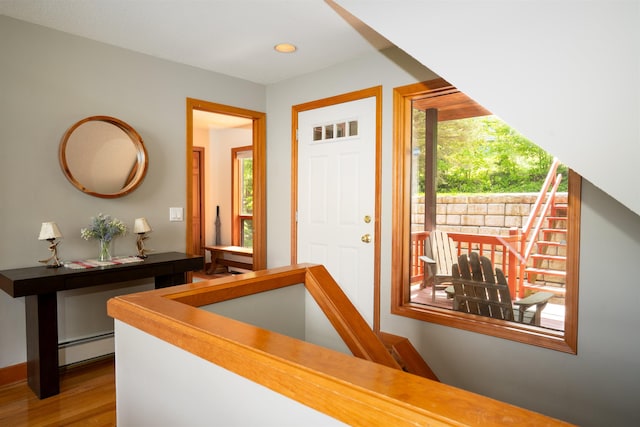 25 Benson Fuller Rd, Winhall, VT 05340 - foyer with plenty of natural light, a baseboard radiator, wood finished floors, and recessed lighting