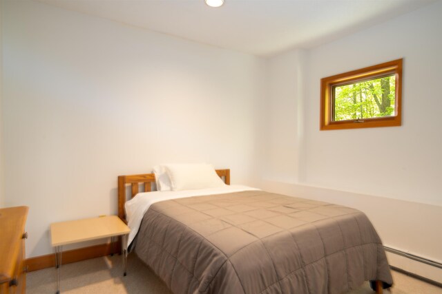 25 Benson Fuller Rd, Winhall, VT 05340 - carpeted bedroom featuring baseboard heating and recessed lighting