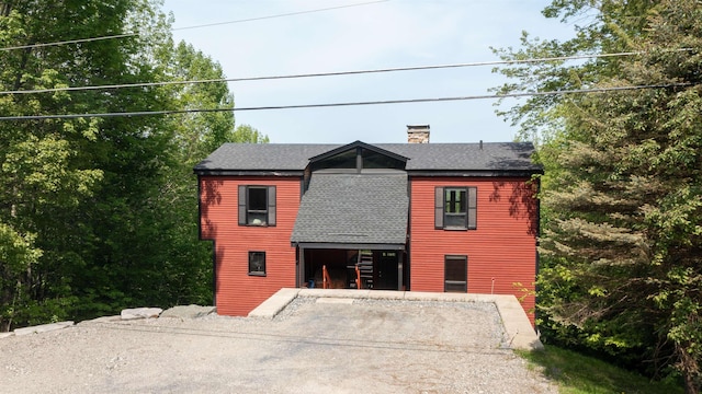 25 Benson Fuller Rd, Winhall, VT 05340 - view of front of property featuring a shingled roof and a chimney