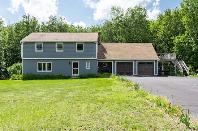 153 Mudgett Hill Rd, Loudon, NH 03307 - colonial-style house featuring a garage, stairs, a front lawn, a chimney, and asphalt driveway