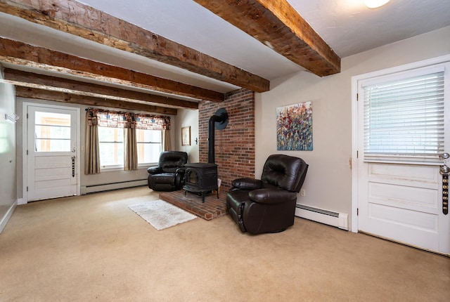 153 Mudgett Hill Rd, Loudon, NH 03307 - sitting room featuring a wood stove, baseboard heating, carpet flooring, and beam ceiling