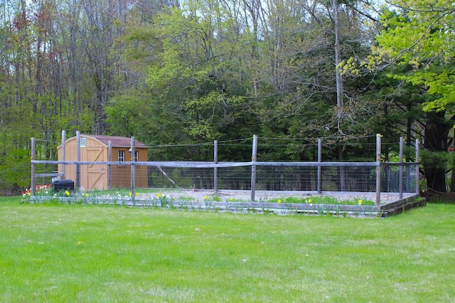 153 Mudgett Hill Rd, Loudon, NH 03307 - view of green lawn featuring a storage unit and a forest view