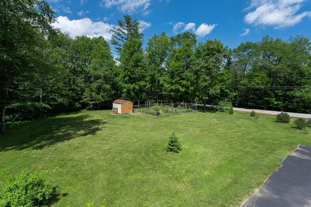 153 Mudgett Hill Rd, Loudon, NH 03307 - view of green lawn with a shed and a garden