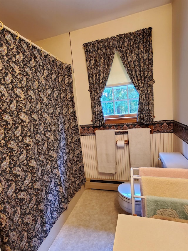 381 Cross Ave Unit 9, 10, Saint Johnsbury, VT 05819 - full bath with a baseboard heating unit, wainscoting, and a shower with shower curtain