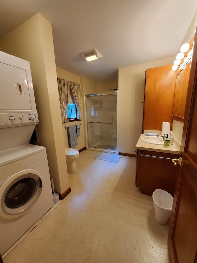 381 Cross Ave Unit 9, 10, Saint Johnsbury, VT 05819 - bathroom featuring stacked washer / drying machine, a stall shower, and vanity