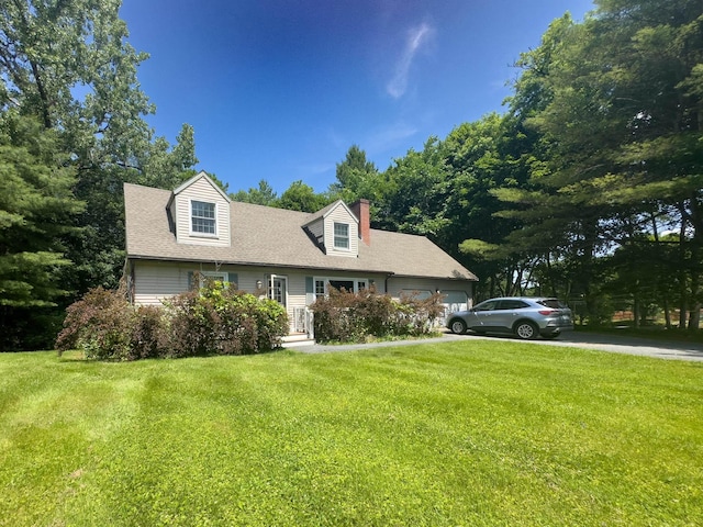 1 Wyeth Farm Cir, Lebanon, NH 03784 - cape cod-style house with a front yard, an attached garage, a chimney, and a shingled roof