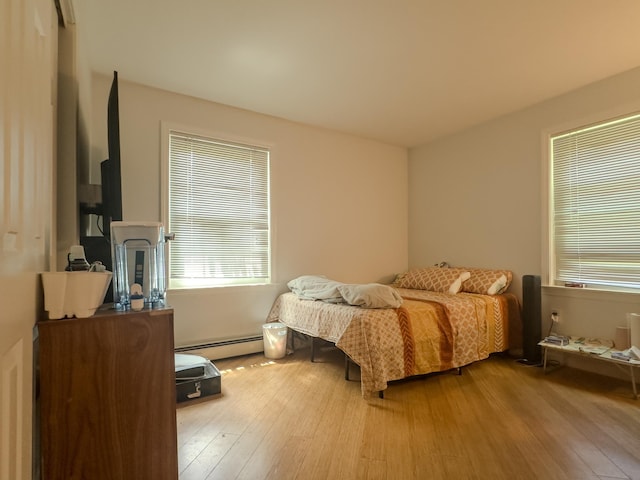 1 Wyeth Farm Cir, Lebanon, NH 03784 - bedroom with hardwood / wood-style flooring and a baseboard heating unit