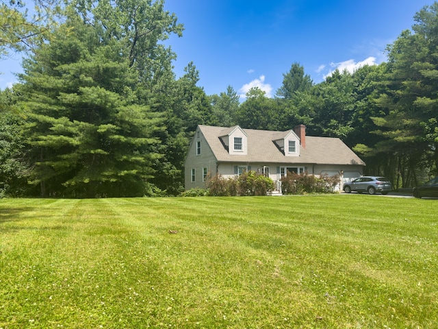 1 Wyeth Farm Cir, Lebanon, NH 03784 - cape cod house with an attached garage, a front lawn, and a chimney