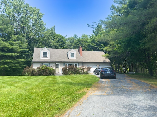 1 Wyeth Farm Cir, Lebanon, NH 03784 - new england style home featuring driveway, an attached garage, a front lawn, and a chimney