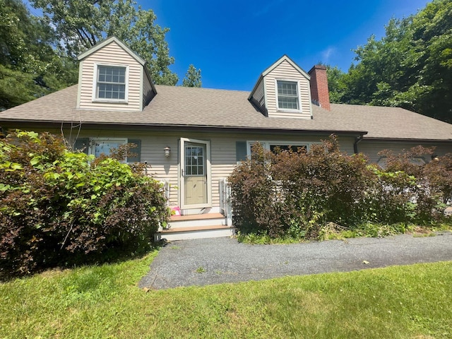 1 Wyeth Farm Cir, Lebanon, NH 03784 - view of front of house with a chimney and a shingled roof