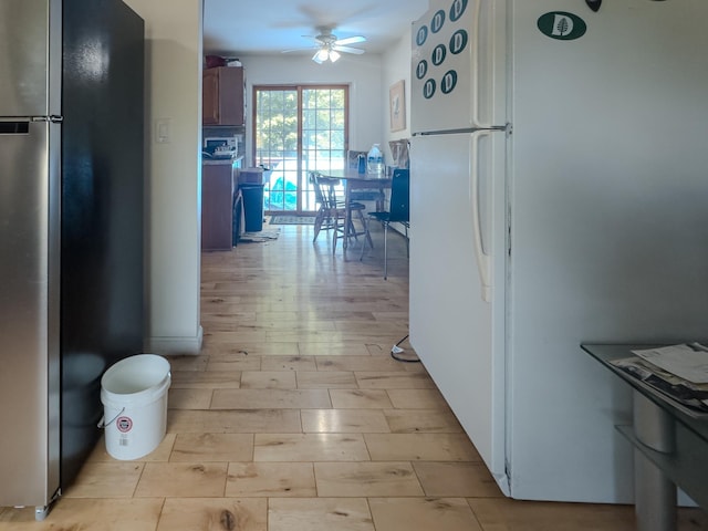 1 Wyeth Farm Cir, Lebanon, NH 03784 - kitchen with freestanding refrigerator, a ceiling fan, and light wood-style floors