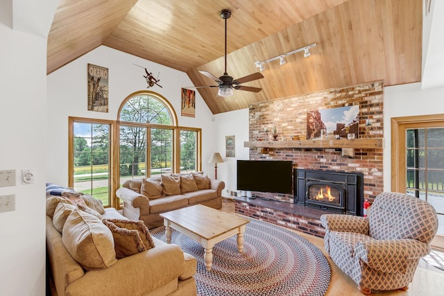 490 W Hill Rd, Ludlow, VT 05149 - living room with track lighting, wooden ceiling, a fireplace, high vaulted ceiling, and ceiling fan