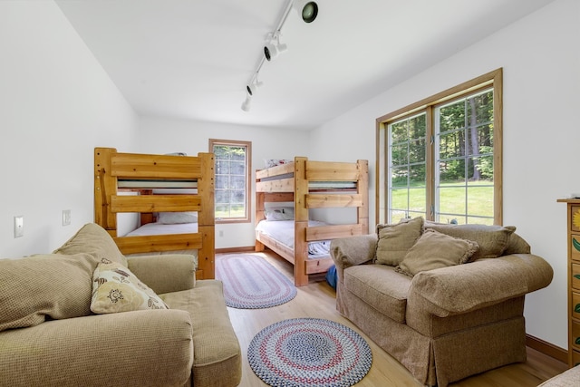 490 W Hill Rd, Ludlow, VT 05149 - bedroom with wood finished floors and track lighting