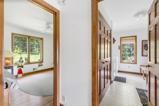 490 W Hill Rd, Ludlow, VT 05149 - hallway with plenty of natural light and light floors