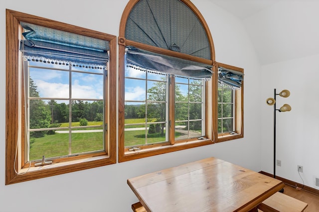 490 W Hill Rd, Ludlow, VT 05149 - dining space with lofted ceiling and wood finished floors