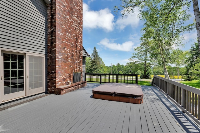 490 W Hill Rd, Ludlow, VT 05149 - wooden deck with a covered hot tub and view of wooded area