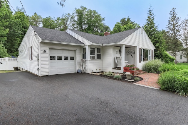 3 Mooreland Ave, Concord, NH 03301 - single story home featuring an attached garage, a shingled roof, asphalt driveway, and a chimney