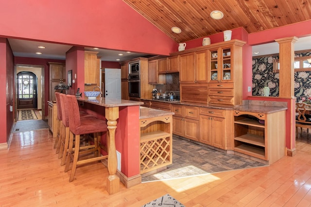 3 Mooreland Ave, Concord, NH 03301 - kitchen featuring appliances with stainless steel finishes, open shelves, brown cabinetry, recessed lighting, and vaulted ceiling