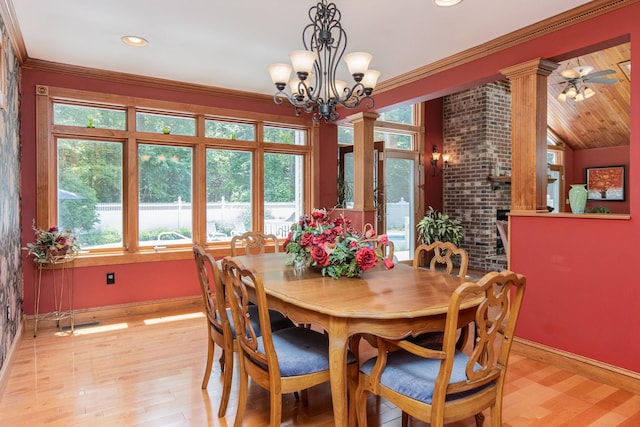 3 Mooreland Ave, Concord, NH 03301 - dining area featuring light wood-style flooring, a chandelier, crown molding, decorative columns, and recessed lighting