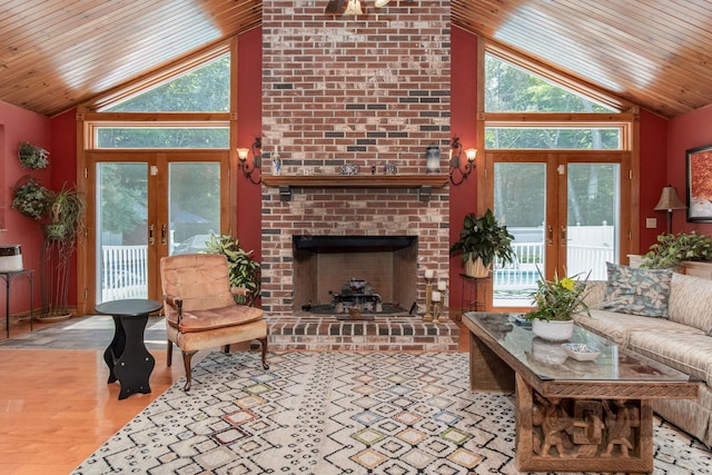 3 Mooreland Ave, Concord, NH 03301 - living room with french doors, wooden ceiling, a fireplace, wood finished floors, and high vaulted ceiling