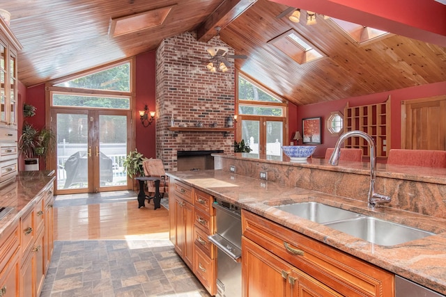 3 Mooreland Ave, Concord, NH 03301 - kitchen featuring vaulted ceiling, a skylight, light stone countertops, wood ceiling, and stainless steel dishwasher