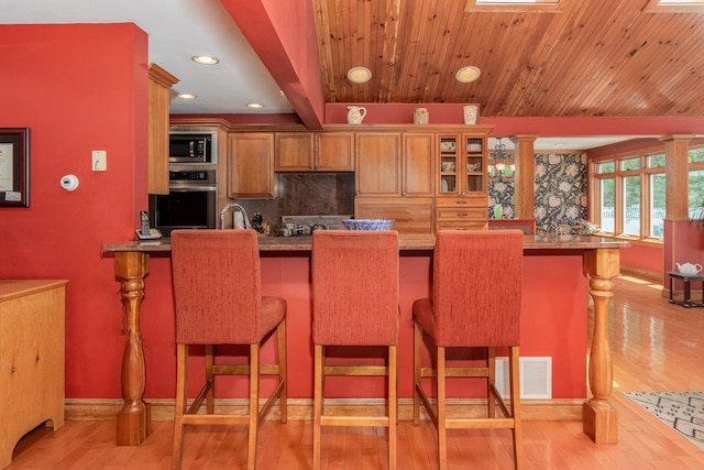 3 Mooreland Ave, Concord, NH 03301 - kitchen with oven, built in microwave, light wood-type flooring, glass insert cabinets, and recessed lighting