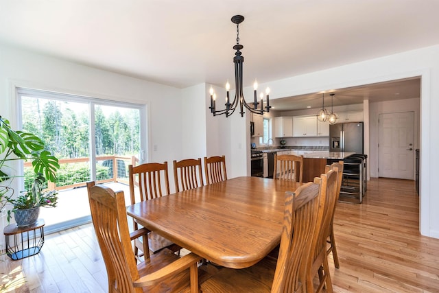 116 Sullivan Center Rd, Gilsum, NH 03448 - dining area featuring a chandelier and light wood-style flooring