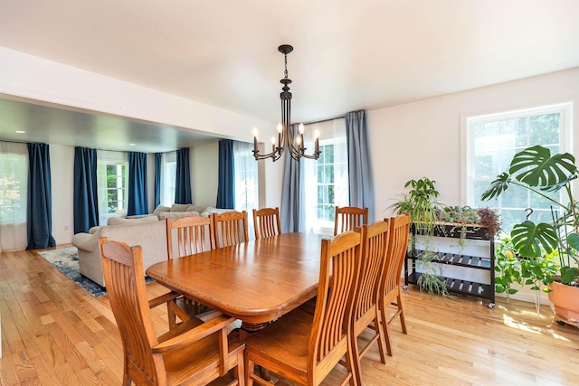 116 Sullivan Center Rd, Gilsum, NH 03448 - dining room with a chandelier and light wood-type flooring