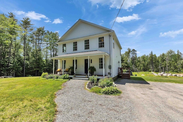 116 Sullivan Center Rd, Gilsum, NH 03448 - view of front of house featuring a front lawn, a porch, and gravel driveway