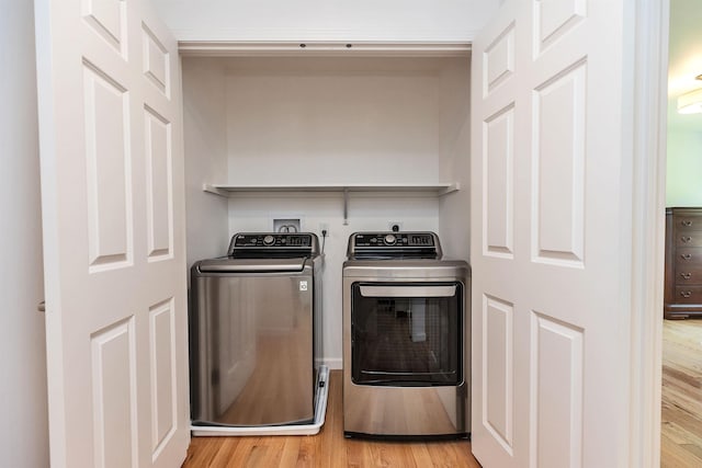 116 Sullivan Center Rd, Gilsum, NH 03448 - laundry room featuring independent washer and dryer and light wood-type flooring