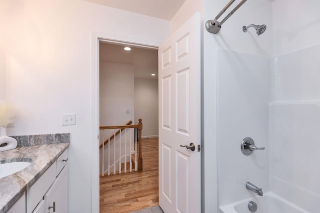 116 Sullivan Center Rd, Gilsum, NH 03448 - full bath featuring wood finished floors, vanity, shower / tub combination, and recessed lighting