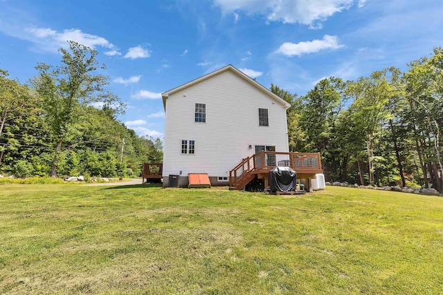 116 Sullivan Center Rd, Gilsum, NH 03448 - rear view of house featuring a wooden deck and a lawn