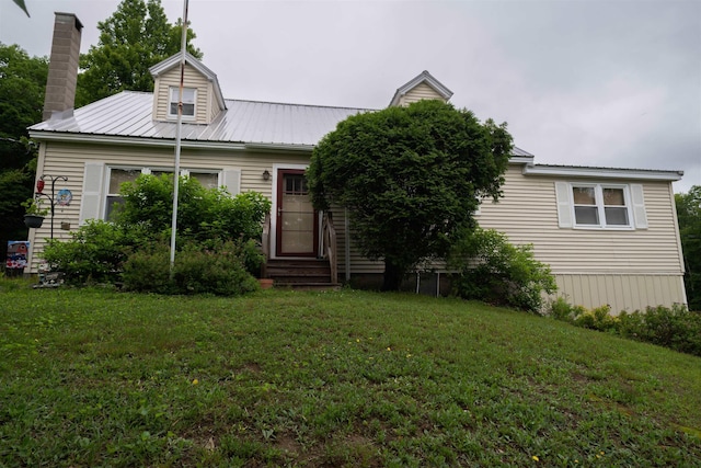 1061 Suncook Valley Rd, Barnstead, NH 03225 - view of front of home with a front lawn, a metal roof, entry steps, and a chimney