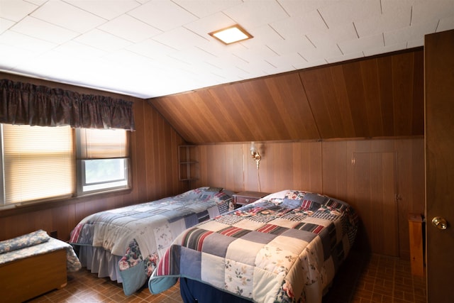 1061 Suncook Valley Rd, Barnstead, NH 03225 - bedroom featuring brick patterned floors, vaulted ceiling, and wood walls