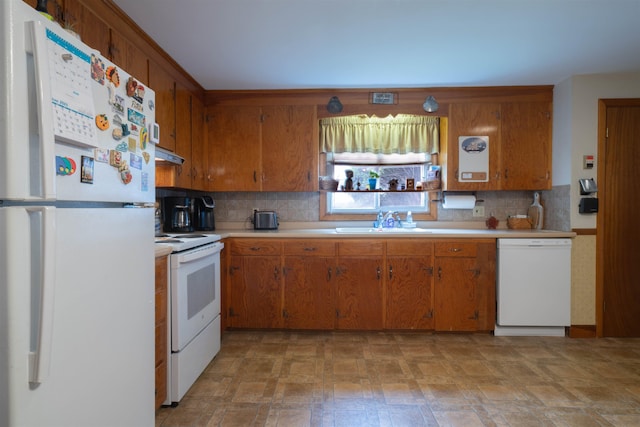 1061 Suncook Valley Rd, Barnstead, NH 03225 - kitchen featuring white appliances, light countertops, backsplash, brown cabinetry, and under cabinet range hood