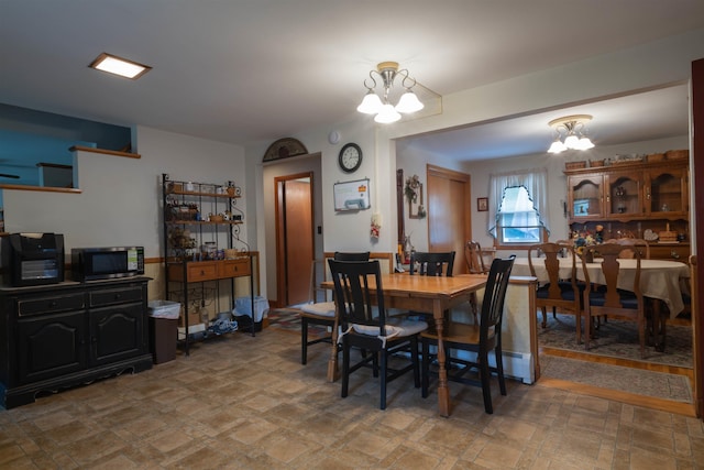 1061 Suncook Valley Rd, Barnstead, NH 03225 - dining space featuring a chandelier