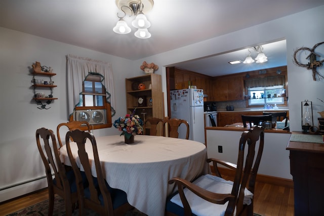1061 Suncook Valley Rd, Barnstead, NH 03225 - dining room with a chandelier, wood finished floors, and baseboard heating