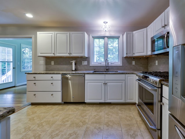 8 Sycamore Ct, Amherst, NH 03031 - kitchen featuring stainless steel appliances, healthy amount of natural light, white cabinetry, stone countertops, and recessed lighting