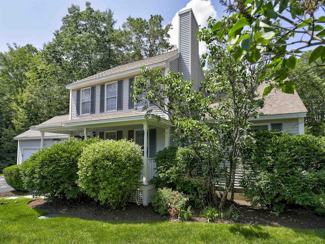 8 Sycamore Ct, Amherst, NH 03031 - view of front of home featuring an attached garage, a chimney, and covered porch
