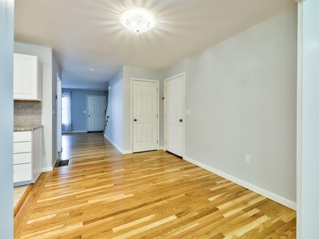 8 Sycamore Ct, Amherst, NH 03031 - spare room with light wood-style floors and baseboards