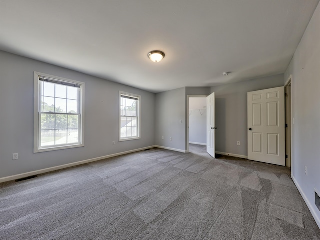 8 Sycamore Ct, Amherst, NH 03031 - unfurnished bedroom with carpet floors and a walk in closet