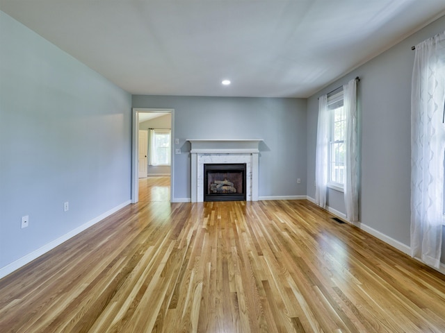 8 Sycamore Ct, Amherst, NH 03031 - unfurnished living room with a fireplace, light wood finished floors, and recessed lighting