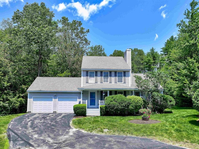 8 Sycamore Ct, Amherst, NH 03031 - view of front of home featuring a garage, covered porch, driveway, and a front lawn