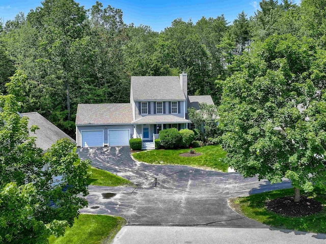 8 Sycamore Ct, Amherst, NH 03031 - colonial house with a garage, driveway, a chimney, and a front lawn