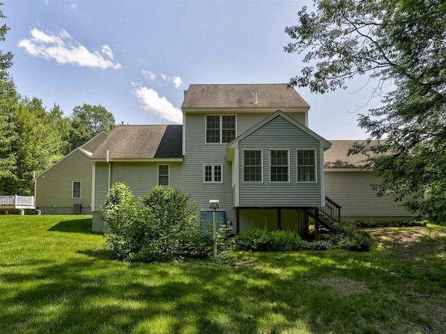 8 Sycamore Ct, Amherst, NH 03031 - back of property featuring stairs, a lawn, and roof with shingles