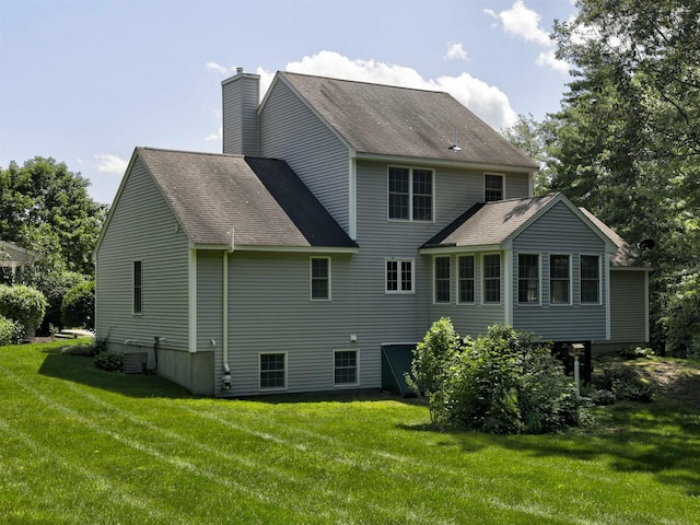 8 Sycamore Ct, Amherst, NH 03031 - rear view of property featuring a shingled roof, a yard, and a chimney