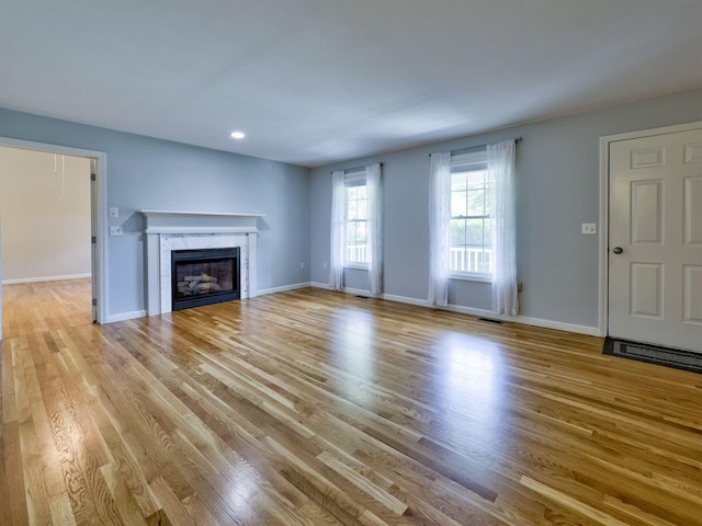 8 Sycamore Ct, Amherst, NH 03031 - unfurnished living room with wood finished floors, a fireplace, and recessed lighting