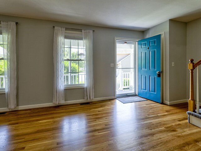 8 Sycamore Ct, Amherst, NH 03031 - entryway with plenty of natural light, wood finished floors, and stairs