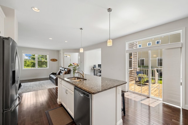 394 Zephyr Rd, Williston, VT 05495 - kitchen with stainless steel appliances, dark wood finished floors, open floor plan, white cabinets, and recessed lighting