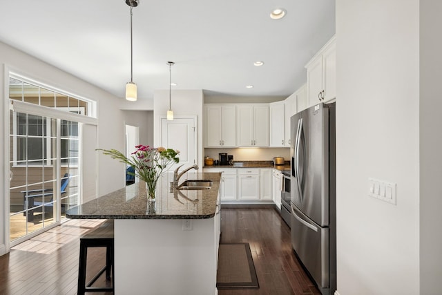 394 Zephyr Rd, Williston, VT 05495 - kitchen featuring stainless steel appliances, dark wood finished floors, white cabinetry, recessed lighting, and a breakfast bar